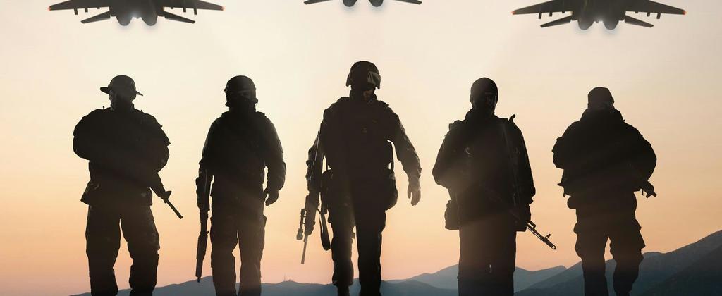 Shadows of five soldiers in a row with fighter jets in the air above them