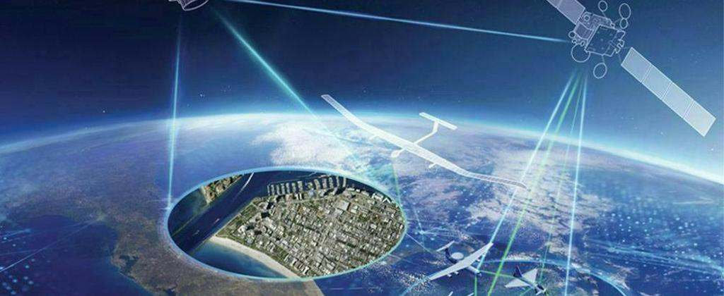Earth Observation satellite overseeing a specific location while communicating with a communication satellite interconnected with several military domains.