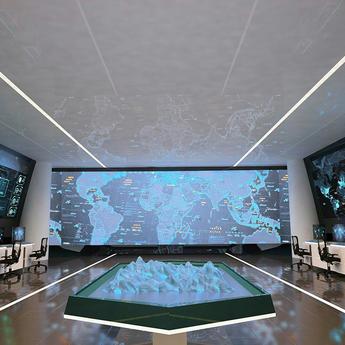 Big room with lots of computer working places and huge screens