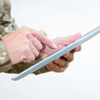 Soldier with tablet in his hand