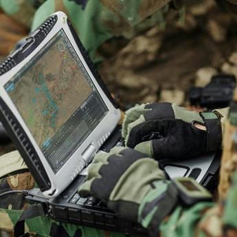 Soldier typing on a computer