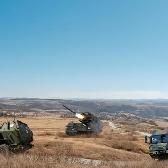  Military vehicles like rocket launchers in a rough landscape