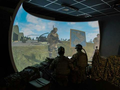 Soldiers in a training centre using augmented or virtual reality for training purposes 