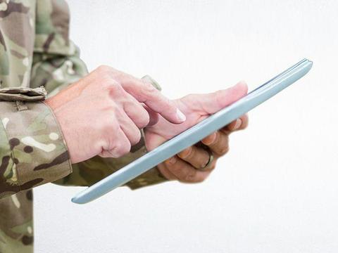 Soldier with tablet in his hand