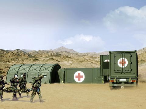 Aerial photograph of a Role Two Rescue Centre in the field, consisting of interconnected tents and containers.