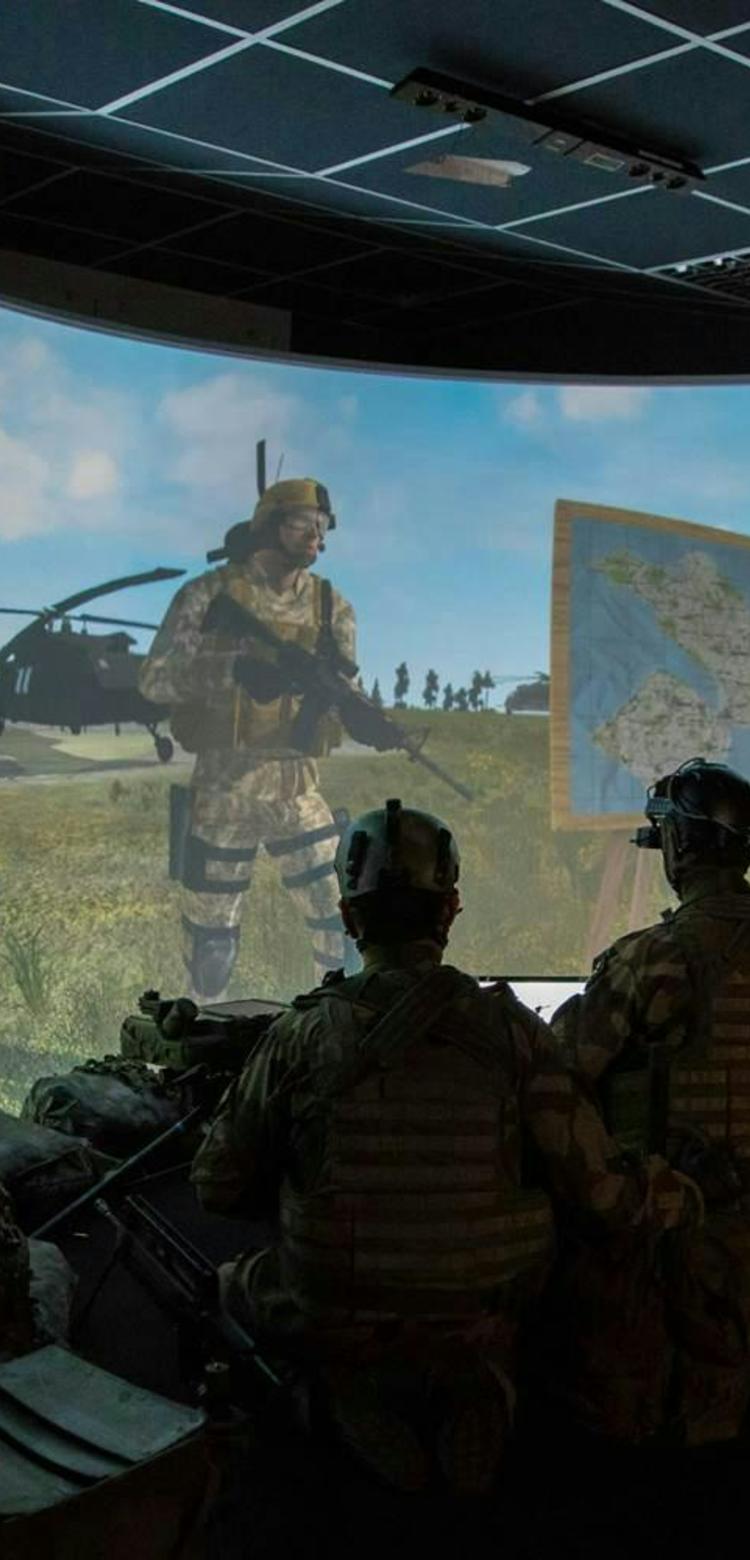 Soldiers in a training centre using augmented or virtual reality for training purposes Soldiers in a training centre using augmented or virtual reality for training purposes