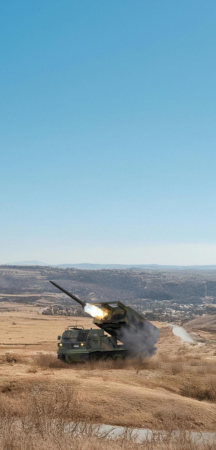  Military vehicles like rocket launchers in a rough landscape