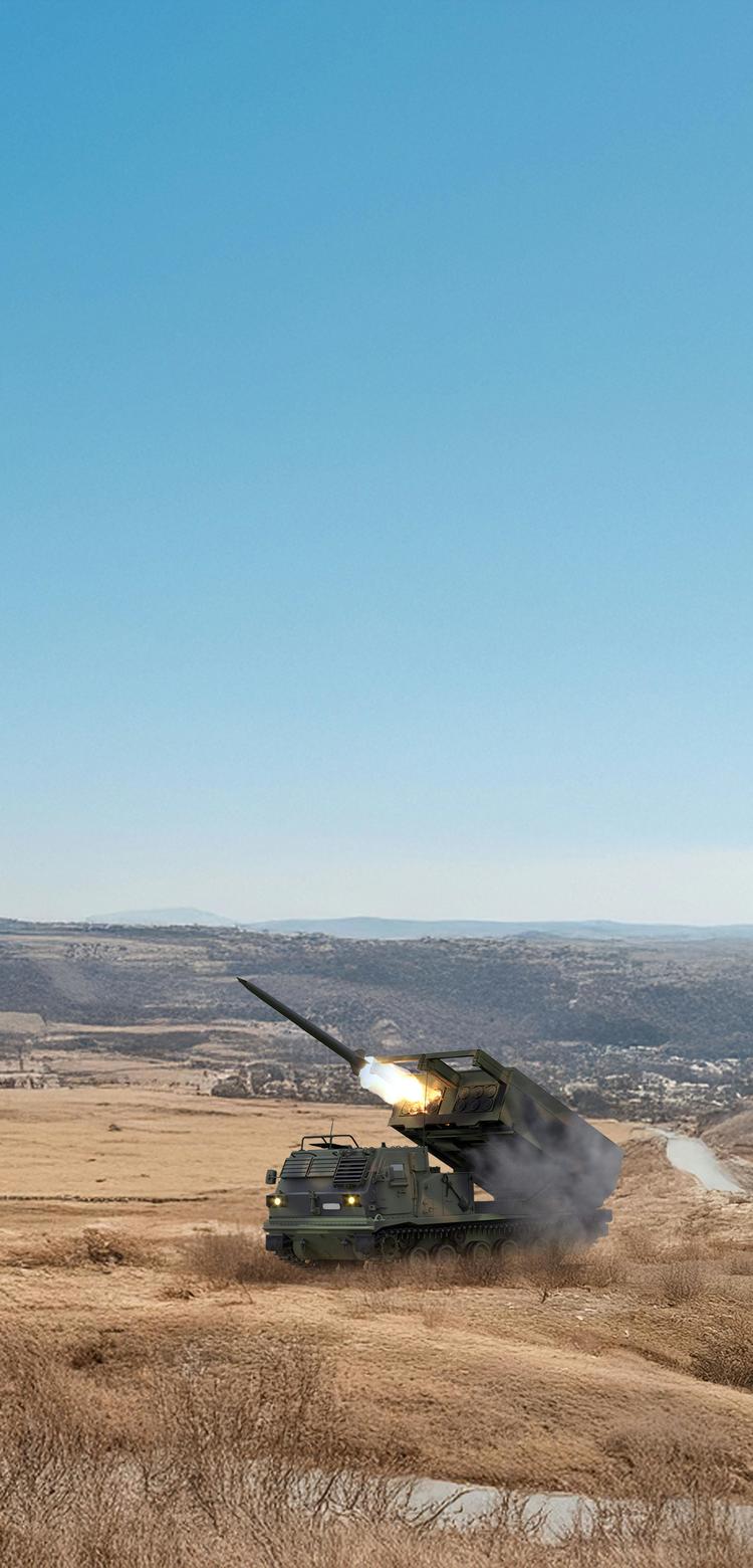 Military vehicles like rocket launchers in a rough landscape
